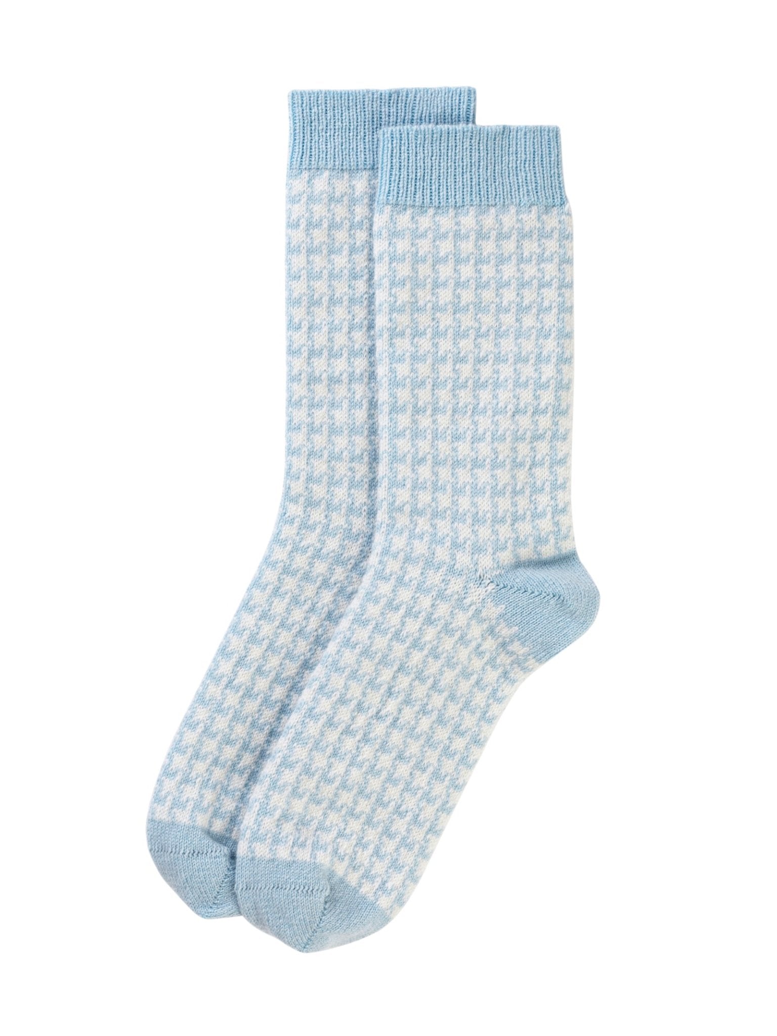 A pair of Campbell’s of Beauly Cashmere Houndstooth Socks in crew length, showcasing a light blue and white houndstooth pattern with solid light blue heels, toes, and cuffs, laid flat on a white background.