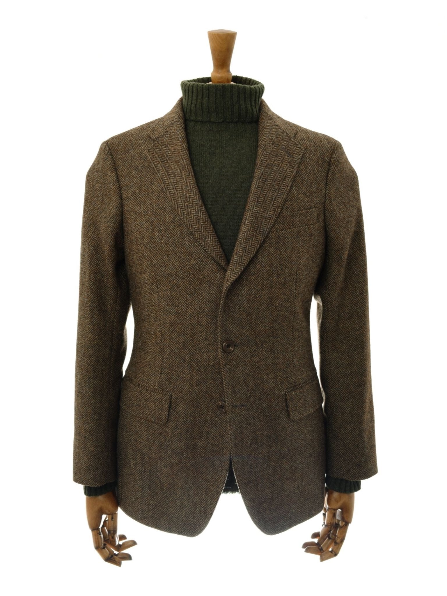 The Campbell's House Jacket by Campbell's of Beauly is shown on a mannequin with wooden hands, paired with a dark green turtleneck sweater, against a plain white background.