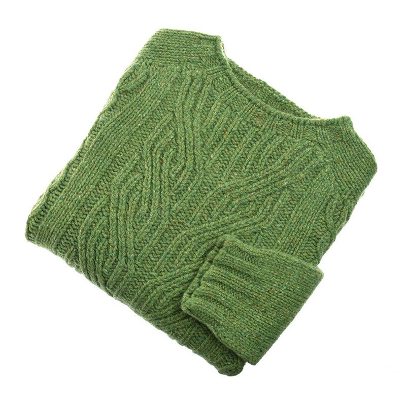 The Campbell's of Beauly Auld Stock Donegal Lambswool Cable Jumper in Eriskay is shown folded on a white background, with one sleeve neatly placed over the front to display its textured pure wool finish.
