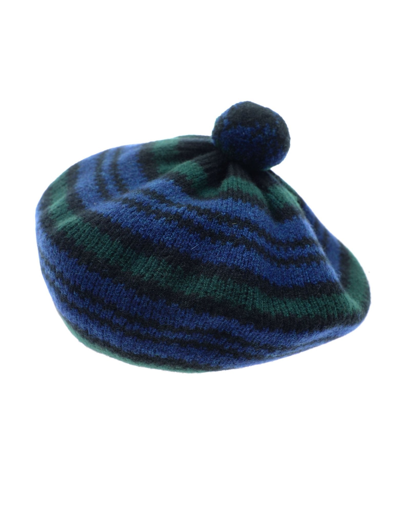 The Lambswool Tartan Beret by Campbell's of Beauly features green and blue stripes inspired by Blackwatch Tartan, topped with a matching pom-pom, shown against a white background.