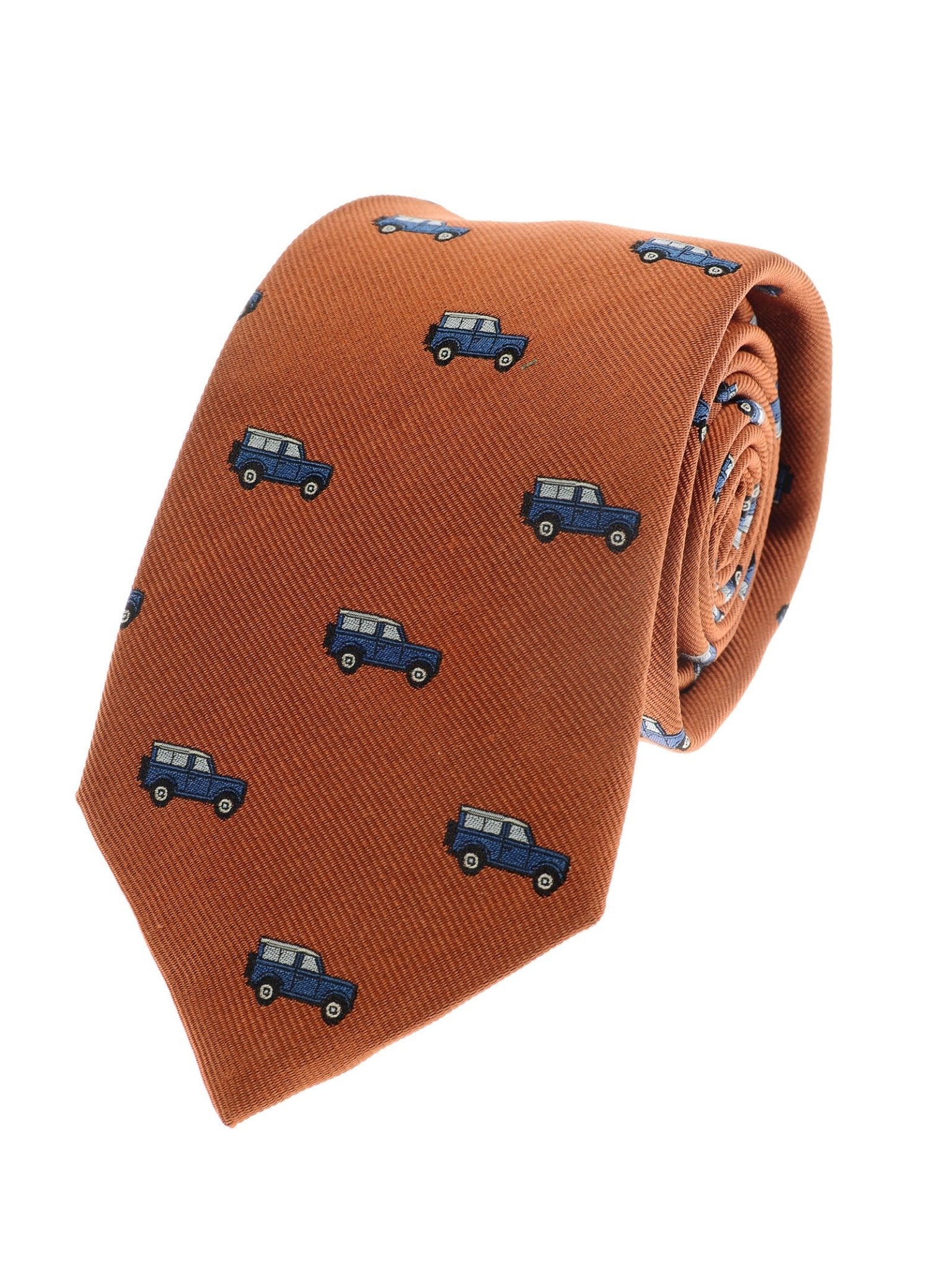The Land Rover Defender Tie by Campbell's of Beauly features rust-hued woven silk with embroidered blue cars, paying tribute to British motoring heritage.