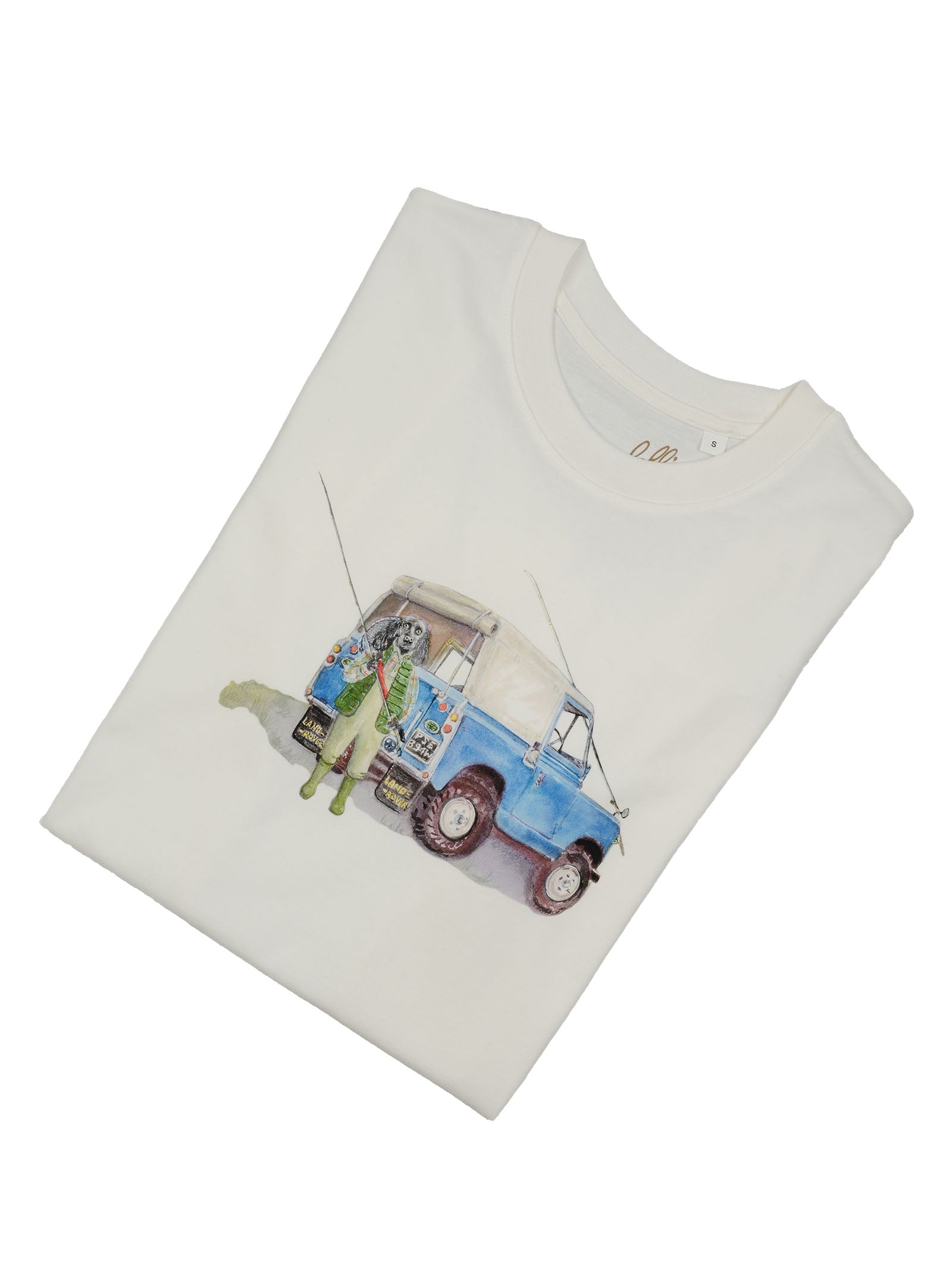The Campbell's of Beauly Land Rover Cocker T-Shirt is a folded white tee with an illustration of two people fishing beside a vintage blue and white Land Rover, complete with rods and gear. Ideal for a country outing.