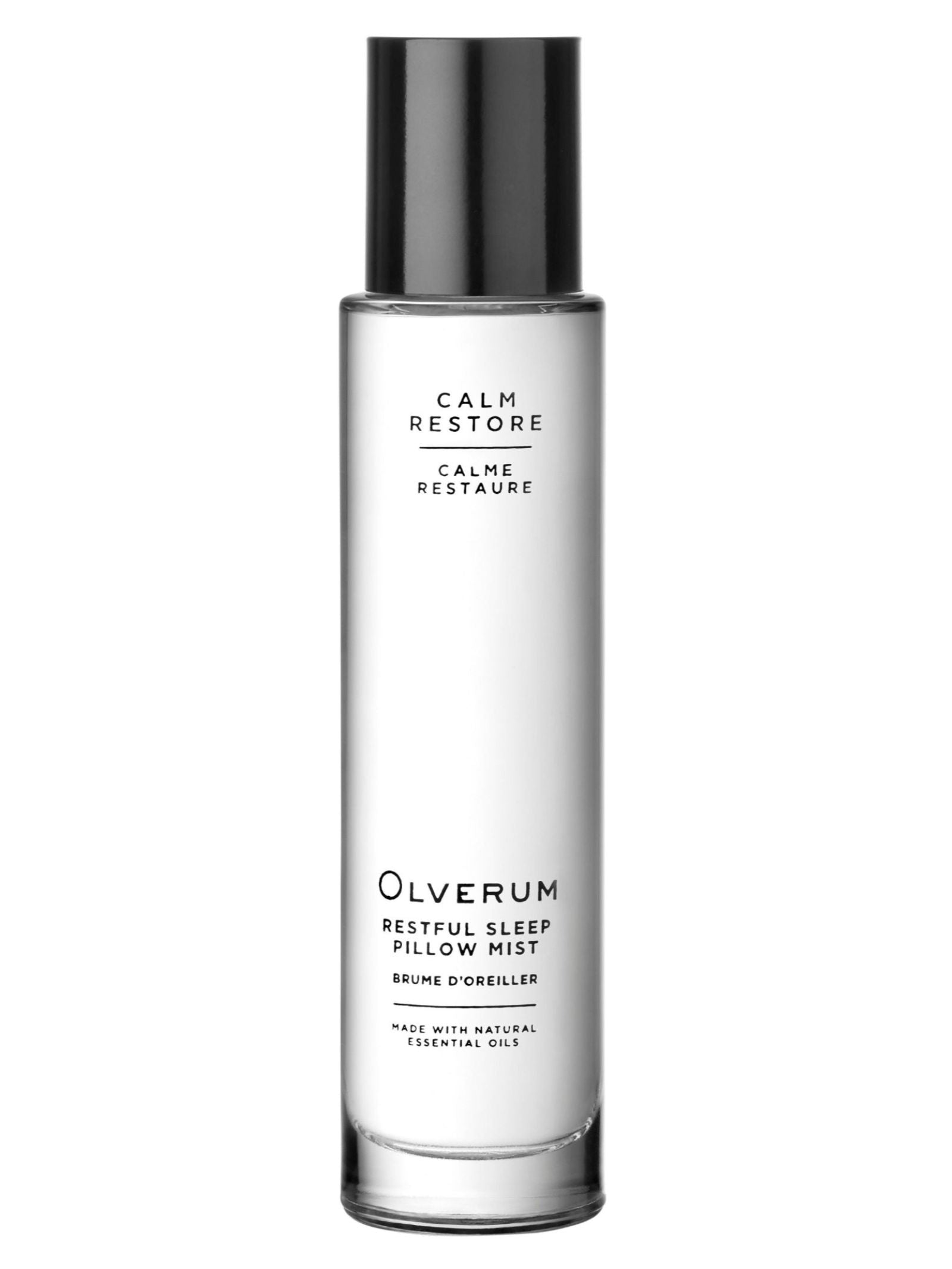 A tall, clear OLVERUM Restful Sleep Pillow Mist bottle with black text and cap, featuring "Calm Restore" and "Made with natural essential oils"—this aromatic mist is perfect for restful nights.