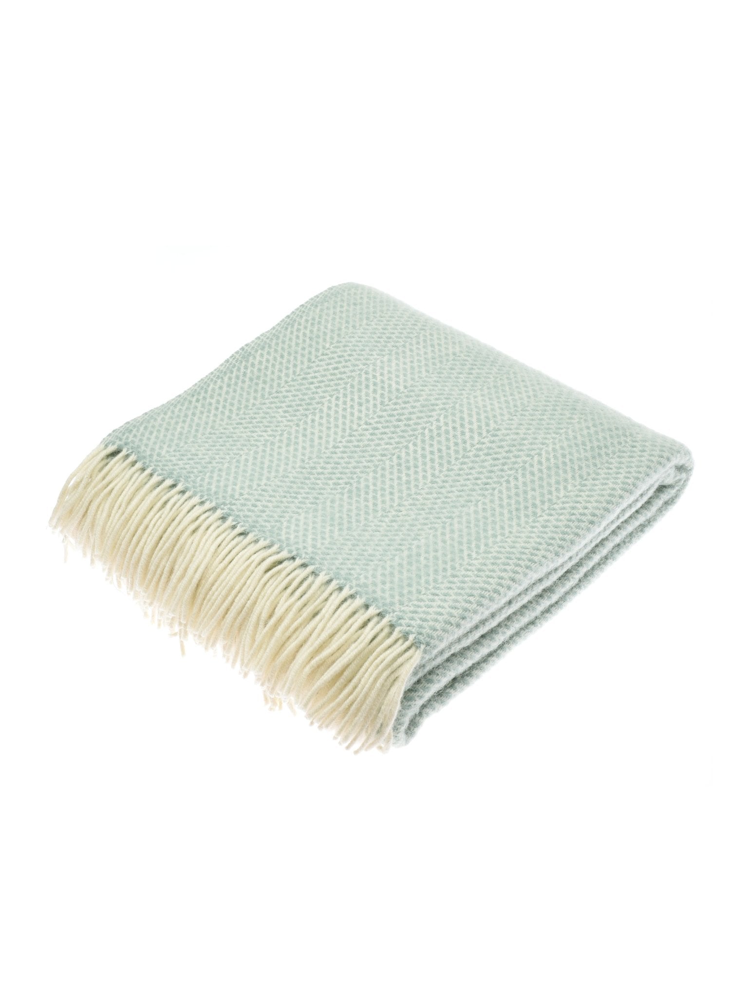 The Campbell's of Beauly Stipled Twill Blanket features a light blue herringbone pattern, lightweight construction, and cream-colored fringes, shown neatly folded on a white background.