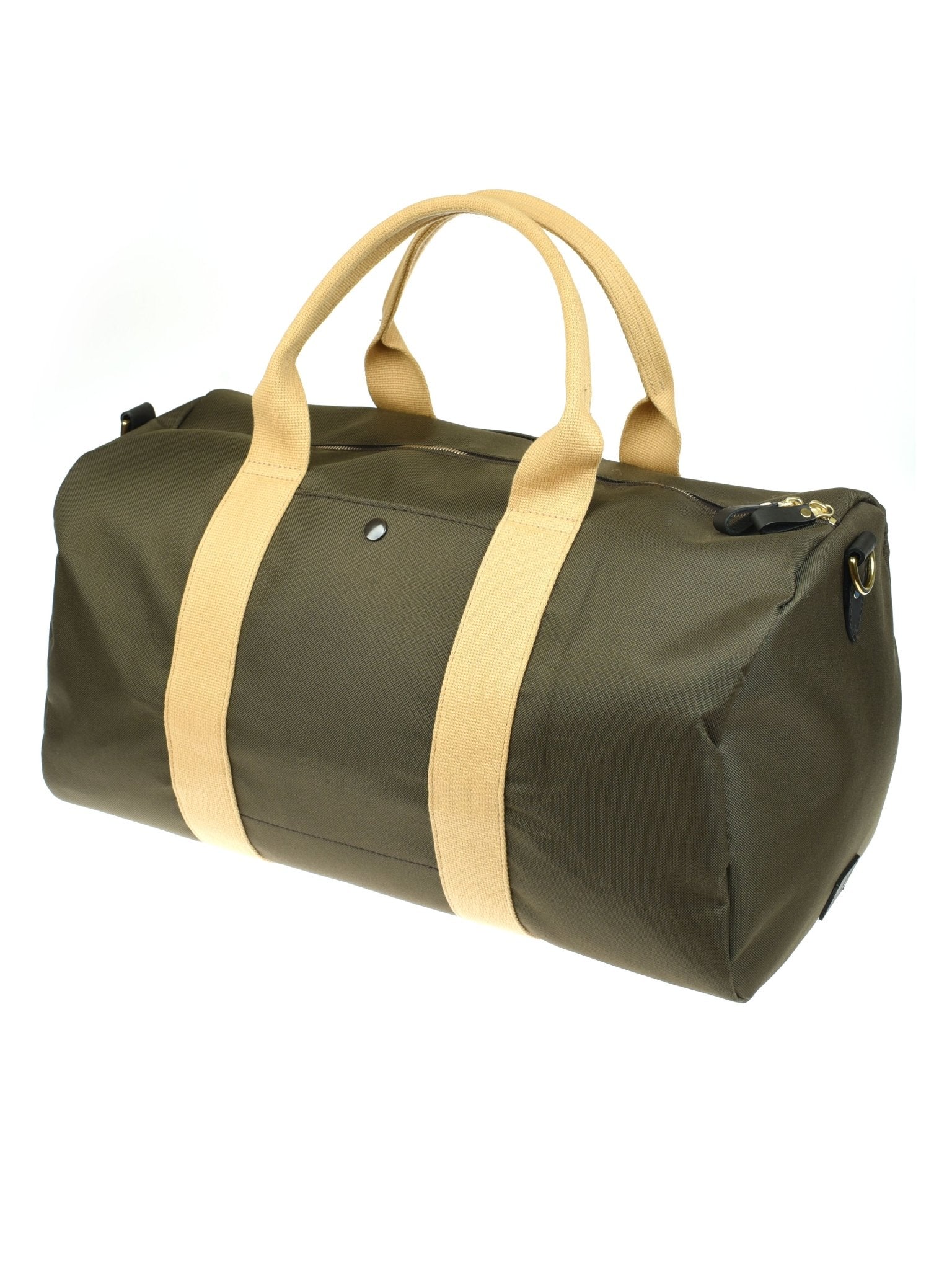 The Utility Medium Duffle by Campbell's of Beauly is crafted from heavy-duty green canvas with tan handles and straps, a zip closure, metal snap detail, and reinforced corners—offering a durable, minimally designed rectangular travel bag.