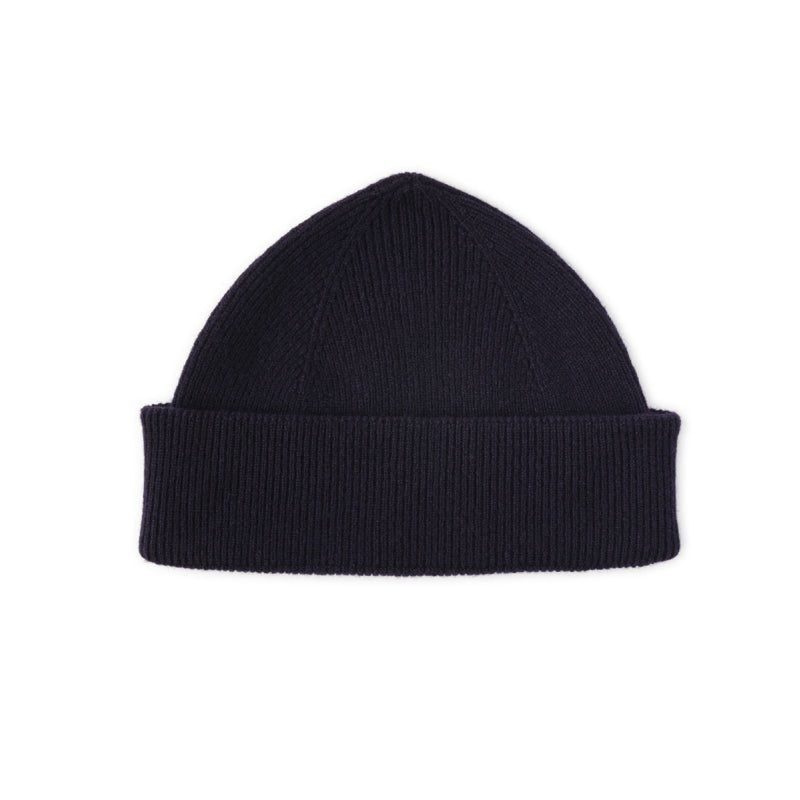 The Campbells of Beauly Watchman Hat in navy is a plain lambswool hat with a folded cuff, inspired by the winter warmth of the Scottish Borders and shown on a white background.